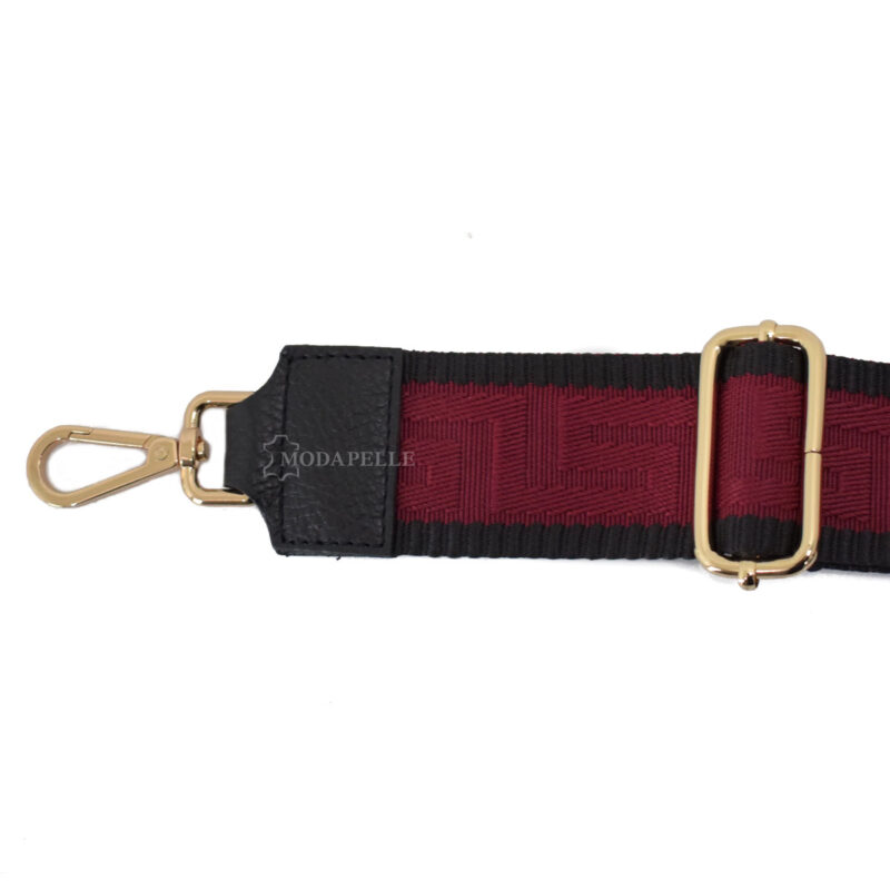 Adjustable bag strap, in red color (meander texture). With gold metallic parts and leather finishes