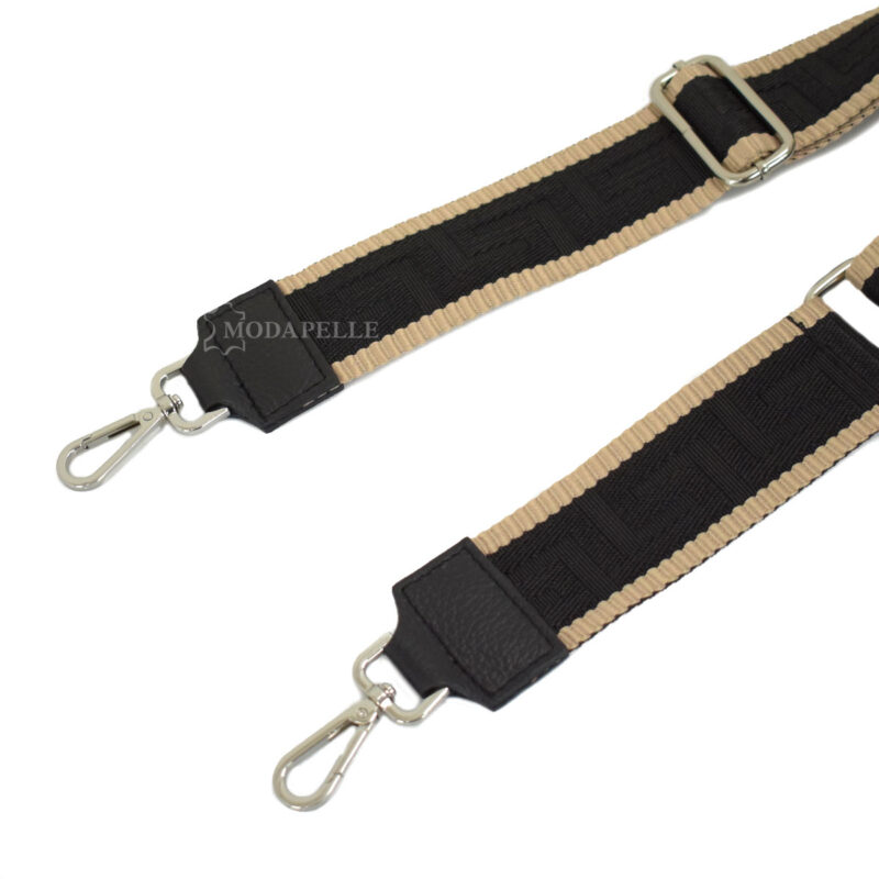 Adjustable bag strap, in black color (meander texture). With silver metallic parts and leather finishes