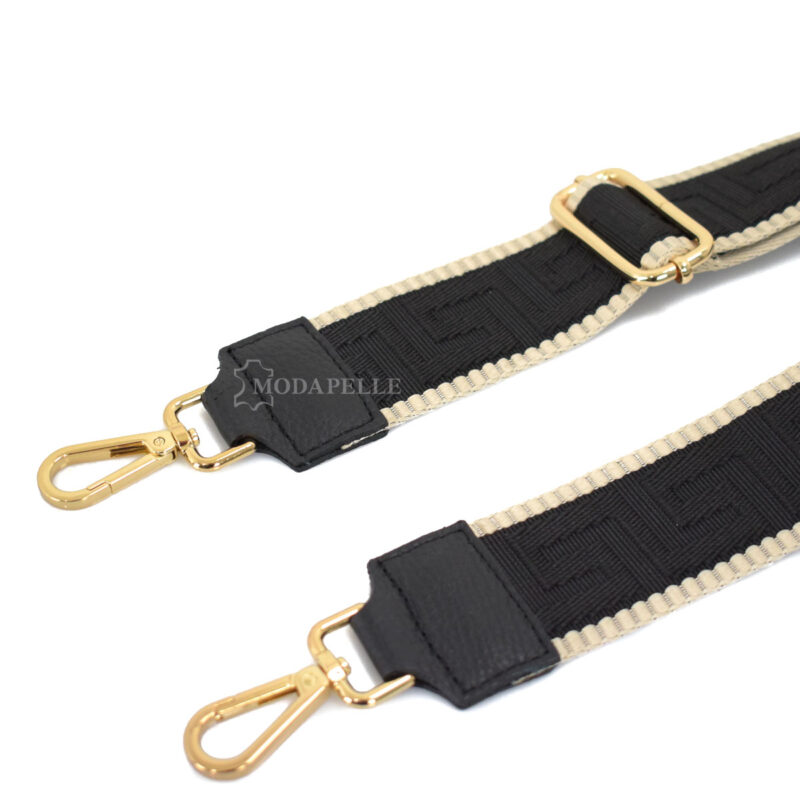 Adjustable bag strap, in black color (meander texture). With gold metallic parts and leather finishes