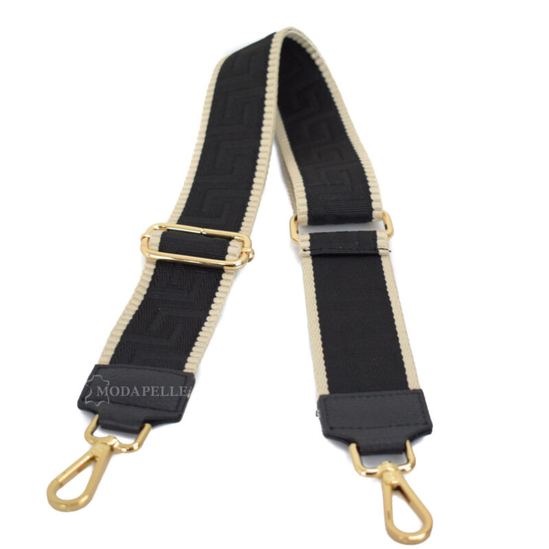 Adjustable bag strap, in black color (meander texture). With gold metallic parts and leather finishes