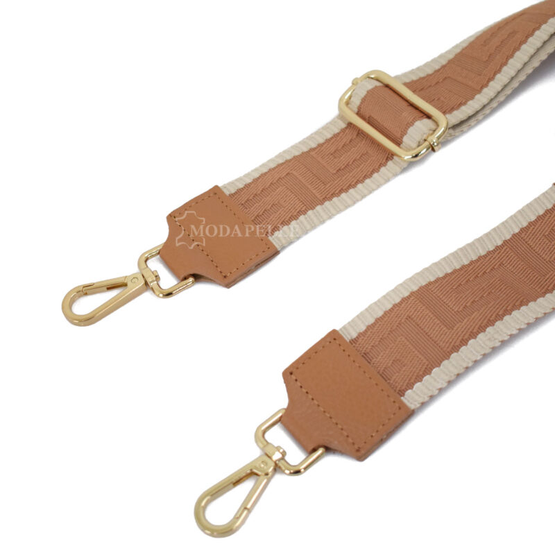 Adjustable bag strap, in tan color (meander texture). With gold metallic parts and leather finishes